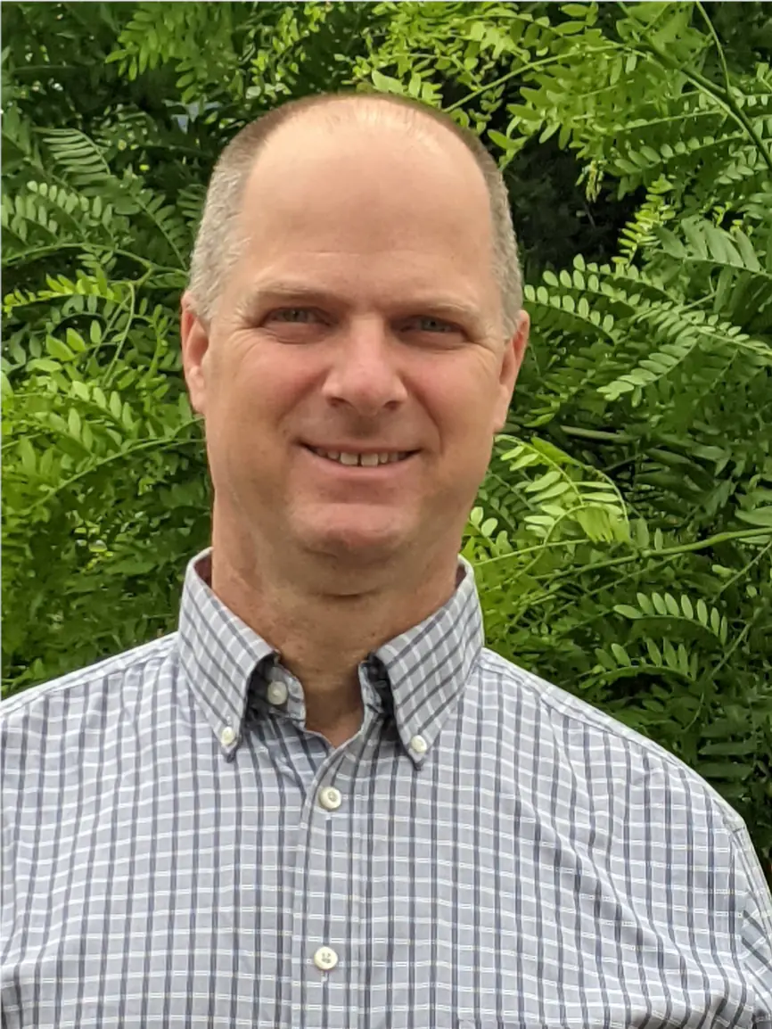Christian Guertler with a tree in the background